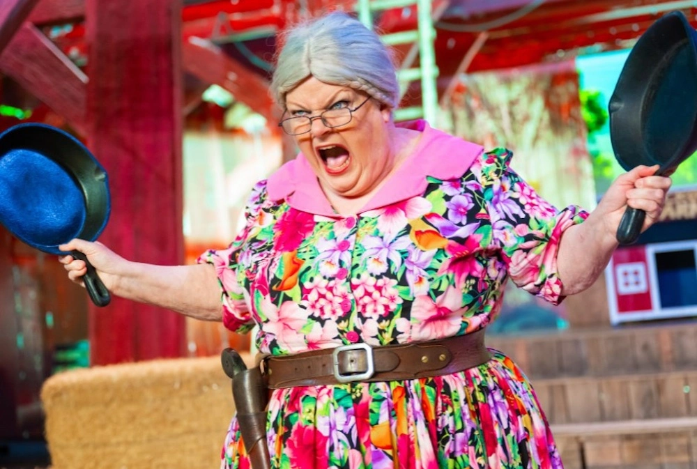 Ma McCoy holding frying pans